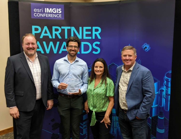 Ian receiving the partner award for Innovative Analytics at Esri IMGIS 2023